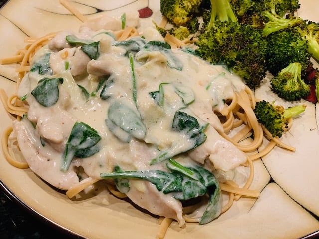 creamy spinach artichoke chicken with a side of roasted broccoli