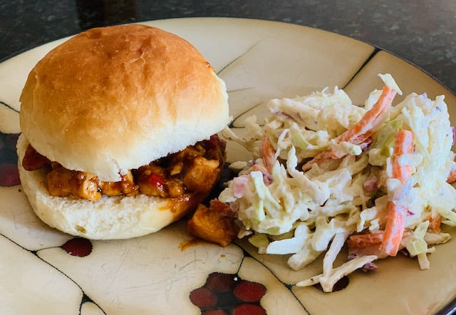 Coleslaw with pulled chicken sandwich