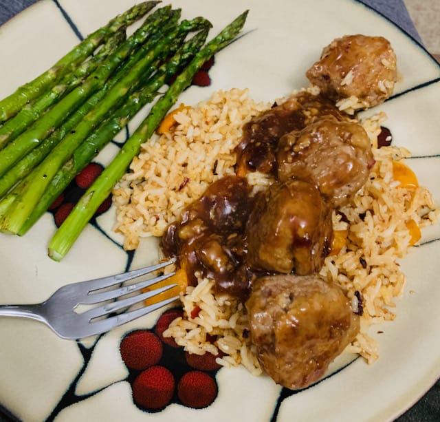Sweet & sour meatballs, spicy sesame coconut rice and asparagus. 